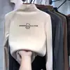 Camiseta básica de forro polar con cuello alto medio para niñas, nuevo estilo primavera y otoño 2026, ropa interior de manga larga moderna para niños, top de estudiante con dibujos animados
