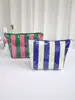 Bolsa de Maquillaje Impermeable de PVC de Nuevo Modelo Transfronteriza para Mujer, Neceser Rayado de Gran Capacidad, Bolsa de Almacenamiento de Viaje Versátil de Alto Valor
