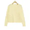 Exportación al por mayor Ropa de mujer 2025 Otoño Europea y Americana Decoración de flor tridimensional Cuello redondo Manga larga Cardigan de punto Gama alta