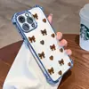 La funda de teléfono más vendida de Tk Station estilo Ins, con forma de corazón marrón y lazo, simple, electrochapada, con airbag, para iPhone 17 Pro