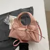 Bolsa de Pulso Nicho Coreana para Mulheres Verão 2026 Nova Casual Design de Nicho Bolsa de Ombro Transversal Bolsa de Mão Bolsa Dumpling
