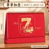 Calendário de Ano Novo de 2027 Vermelho Festivo Vazado Requintado Calendário Bloco de Notas de Planejamento para Escritório Calendário Diário Logo