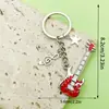 Venta Caliente Transfronteriza Cinta de Música Antigua Saxofón Órgano Llavero Diseño Creativo Sentido Colgante de Bolsa Pequeños Accesorios