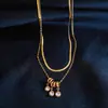 Collar de Acero Inoxidable Europeo y Americano con Colgante de Borla Incrustada de Diamantes Doble Capa Cadena para Clavícula Simple Personalizada Transfronteriza Collar de Gama Alta para Mujeres