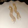 Agulha de prata oco diamante gota de água borla brincos ins estilo luz temperamento de luxo brincos longos brincos de vestido de alta qualidade