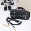 Bolso de Mano Clásico Popular de Comercio Exterior Cuero Genuino Bolso de Mujer Bolso Cruzado de Hombro de Alta Calidad Bolso tipo Concha para Mujer Marca Grande Productos de Guangzhou