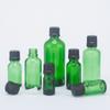 Botella de aceite verde transparente de 5ml-100ml tapa antirrobo embalaje cosmético esencia aceite de masaje subenvasado botella de vidrio