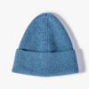 Otoño e invierno Nuevo gorro de lana color liso gorro de punto de placa ligera logo imitación piel de conejo cálido gorra para el frío fabricantes al por mayor
