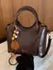 Bolsa Pequeña Super Caliente para el Trayecto Diario para Mujer 2026 Nuevo Verano Lujo Ligero Bolso Cubo de Hombro Cruzado Bolso de Mano