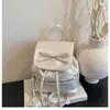 Mochila de Diseño Nicho Coreano Transfronteriza para Mujer Modelo Nuevo 2026 con Cordón de Lazo Mochila Pequeña Versátil para Estudiante