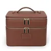 Bolsa de cosméticos de doble capa de cuero PU nueva transfronteriza de gran capacidad, multipropósito, con compartimentos desmontables y un asa para facilitar su transporte como organizador de viaje