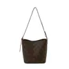 Bolsa pequeña súper caliente de comercio exterior, nuevo estilo 2026 para mujer, bolso pequeño tipo cubo de nicho, moderno, elegante, versátil, bolso de un solo hombro cruzado