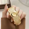Pulsera Nueva Creativa Comercio Exterior Nicho Venta Caliente Reloj de Moda para Dama Reloj para Mujer Sensación de Alta Gama Oro Lujo Reloj de Cuarzo