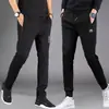 Pantalones casuales gruesos para hombre de primavera y otoño, joggers deportivos holgados de cintura alta de corte slim versátiles con cremallera y perneras rectas