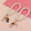Llavero de Corazón de Perla para Niña Linda Cadena de Perlas Cabeza de Belleza Accesorios Colgantes Simples Colgante para Llavero de Teléfono Móvil Colgante