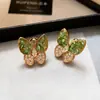 Pendientes de botón de mariposa de nácar natural iridiscente con pasador de plata de ley 925 para mujer, joyería para orejas de lujo ligero de nicho, nuevos pendientes de gama alta 2026
