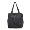 Bolsa tote de nylon com cordão e múltiplos bolsos, grande capacidade, adequada para o trajeto diário, leve, casual, para estudantes, e pode ser carregada na mão.
