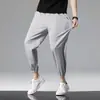Pantalones de verano finos de seda helada para hombre, corte holgado, con puño en los tobillos, pantalones deportivos de nueve puntos, pantalones de aire acondicionado de secado rápido, pantalones largos casuales para hombre
