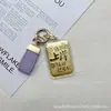 Llavero de Oro Puro 999 Colgante Bolsa de Aterrizaje Dorada Accesorio de Moda Versátil Venta al por Mayor desde la Tienda Water Shell