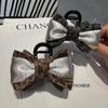 2025 Advanced Sense Deep Leopard Bow High 10CM Clip de agarre en la parte posterior de la cabeza Media horquilla para el cabello Accesorio elegante para el cabello