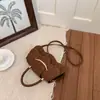 Bolso Pequeño Cuadrado Versátil de Diseño de Nicho de Moda para Mujer 2026 Elegante de Color Sólido Estilo Pequeño Chanel Alta Textura Bolso Cruzado de Mano