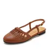 Sandalias de estilo retro para mujer, punta redonda, con borlas, para verano, suela plana, suaves, caladas, transpirables, con tira en T, zapatos de un solo color versátiles, modelo 1003-2