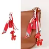 Bolsa de jirafa de moda de alta gama, estilo nuevo, versátil, linda, colgante, borla de bufanda de seda, accesorio de regalo pequeño, transfronterizo
