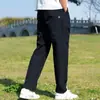 25 Novas Calças Casuais Americanas de Trabalho Funcionais de Verão Triângulo Pequeno Secagem Rápida Largas Afuniladas Calças Casuais Masculinas