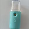 Instrumento hidratante de botón redondo plano Nano spray de mano conveniente cableado Carga USB instrumento facial de vaporización en stock instrumento hidratante