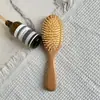 Pente de massagem de madeira de faia estilo mesmo de ponta pente com airbag pente de madeira placa grande pente com almofada de ar de silicone pente doméstico de madeira