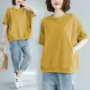 Camiseta de manga curta para cobrir a barriga, tamanho plus size, para mulheres, corte solto, modeladora e que rejuvenesce, novo top versátil de meia-manga de cor sólida para o verão de 2026