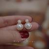 ¡Huevo de paloma socialité! Diseño moderno luz natural fuerte 6A perla de agua dulce aguja de plata S925 aretes de nicho de lujo ligero