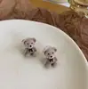 Pendientes de botón de plata s925 al por mayor lindos pendientes de oso con lazo de flocado pendientes simples pendientes de felpa de otoño e invierno