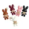 Nuevo lindo personaje de dibujos animados exquisita niña conejita charm para bolso colgante llavero cadena colgante versátil en stock para venta al por mayor