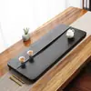 Bandeja de té de piedra Wujin piedra natural completa piedra grande Piedra Oro Negro Mar de té mesa de té simple para el hogar letras del logotipo