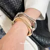 Pulsera Retorcida de Metal Irregular de Venta Caliente Transfronteriza Europea y Americana Estilo Ins Pulsera de Tacto de Alta Gama Sentido de Diseño de Nicho Joyería de Mano