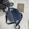 Shuai Mi Home Estilo Perezoso Vaquero para Mujer 2026 Nuevo Bolso de Mano Moda Color-Block Elegante Bolso Cubo de Hombro Único Cruzado