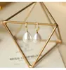 Pendientes de Perla de Circonita de Moda de Aguja Plateada Pendientes de Botón Retro de Lujo Ligero de Nicho Francés Pendientes Nuevos 2026