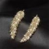 Deseamos Ventas Transfronterizas de Pendientes de la Serie Diamante Incrustado en Cobre de Piedras Preciosas, Joyería Elegante para Mujer, Tornillos para Oreja de Aleación de Titanio de Grado Médico