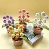 En Stock Tejido a Mano 9 Cabezas Muguete Lindo Hilo de Cuatro Hebras Planta en Maceta Decoración de Escritorio Adorno Planta Artificial en Maceta Venta al por Mayor