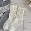 Calcetines de estilo ballet otoño/invierno estilo ins coreano puño suelto borde enrollado longitud hasta media pantorrilla adelgazantes tela de felpa JK etiqueta de tela estilo academia de huevo calcetines largos