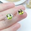 Anillo de olivino natural de imitación de nuevo estilo para mujer, diseño de nicho, fresco, simple, color verde amarillento, anillo tesoro ajustable de boca abierta
