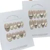 Taoshili [Diamante Triturado Blanco Lechoso] - Una colección versátil, simple y translúcida de puntas de uñas hechas a mano estilo francés, de color amarillo lechoso y con reflejos iridiscentes