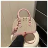 Moda Primavera 2026 Gran Capacidad Texturizado Colorido de Moda Bloques de Color Atmosférico Tejido Popular Bolso de Concha de Hombro Cruzado de Mano