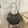 Bolsa de ombro/axila multiuso de couro macio para nicho de comércio exterior, nova bolsa de ombro/mochila casual de alta qualidade com grande capacidade para mulheres, outono/inverno