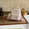 Mochila Estilo Coreano Graffiti Colorido para Mujer Pequeña Fresca Elegante Plegada con Colgante de Muñeca Linda Mochila Escolar para Estudiante