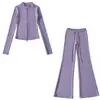 Fabricante mayorista de ropa para mujer transfronteriza 2026 cárdigan térmico de ajuste slim con cuello alto y cremallera y conjunto de pantalones de microcampana hasta el suelo