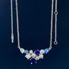 Collar con racimo de flores de nuevo estilo y diamantes completos Diseño con sentido de temperamento de lujo ligero para mujer Colgante de gema de color azul marino acuático Cadena de clavícula