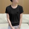 Camiseta de punto sexy de manga corta de alta gama para mujer, prenda de punto fino de verano, top holgado moderno y versátil.