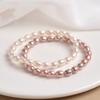 Pulsera de perlas al por mayor para mujer, pulsera de perlas naturales de agua dulce, cuentas de mijo, pulsera de cuerda elástica, nicho simple de lujo ligero